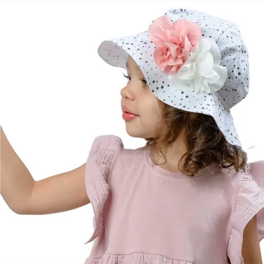 Polka dot hat with flowers.